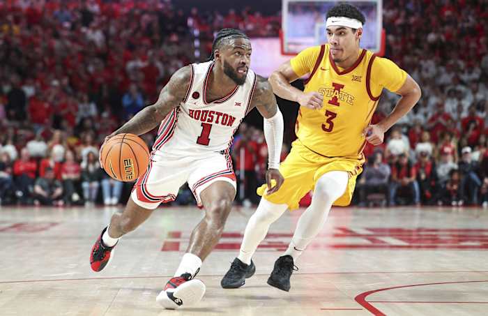 Houston Cougars guard Jamal Shead (1) drives with the ball as Iowa State Cyclones guard Tamin Lipsey (3) defends during the second half at Fertitta Center. 